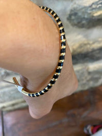 Bracelet jonc or et noir