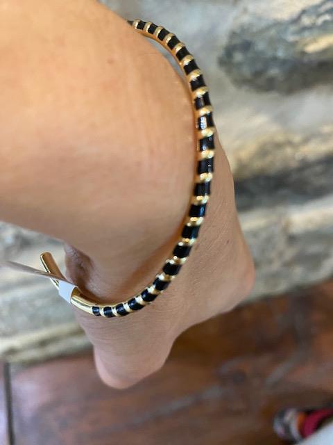 Bracelet jonc or et noir